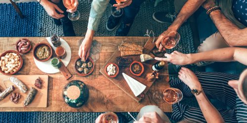 top view of a group of people around a table enjoying food and friendship